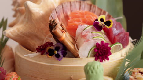 Beautifully-Arranged-Sashimi-Basket-Laid-Out-In-A-Table--panning-close-up-shot