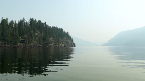 Boating-by-rocky-lake-shore-on-the-Shushwap-lake-in-the-summer