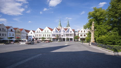 Panorama-style-time-lapse-of-historical-city-center-square-with-people-walking-by-on-summer-sunny-day-in-the-City-of-Žilina-Slovakia