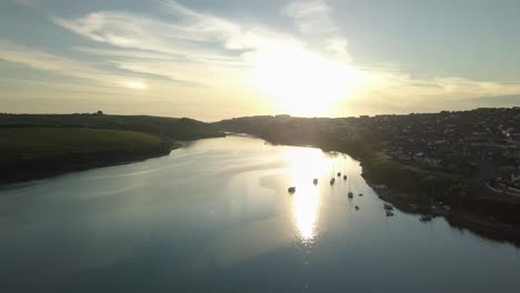 Beautiful-Sunrise-Reflecting-On-Calm-Water-Of-River-Gannel-During-Summer-In-Newquay,-England,-UK