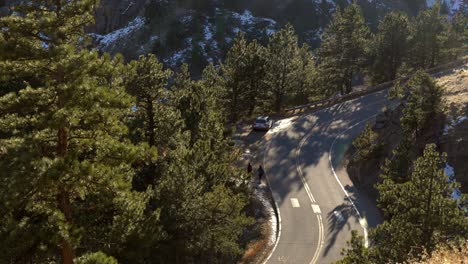Aerial-view-of-car-driving-in-the-mountains