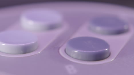 Top-of-Vintage-Super-Nintendo-Controller-in-Purple-Light-SLIDE-LEFT