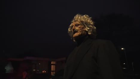 Scary-grandpa-walking-in-the-street-during-halloween