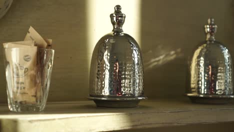 SLOWMO---Old-silver-antique-object-in-luxury-boutique-hotel---CLOSE-UP