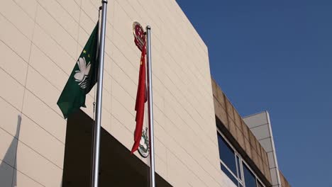 Flags-of-Macau-and-China-flying-outside-Macau-courthouse