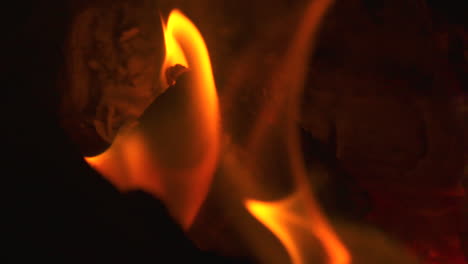 Slow-motion-macro-close-up,-flames-burning-in-a-firepit