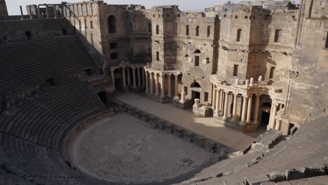 Establishing-shot,-Bosra-amphitheatre-seen-from-above-showing-rows-of-stone-seats