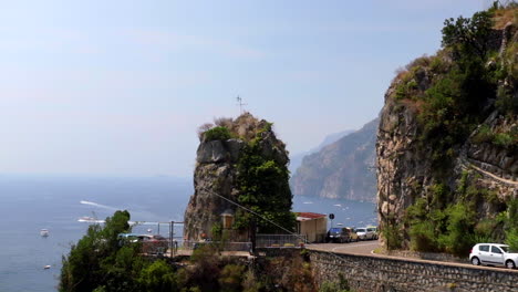 Amalfi-Coast-Cliffside-Road-With-Cars-Going-By
