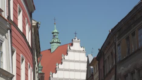 Slow-motion-pan-shot-of-typical-polish-buildings-and-a-church