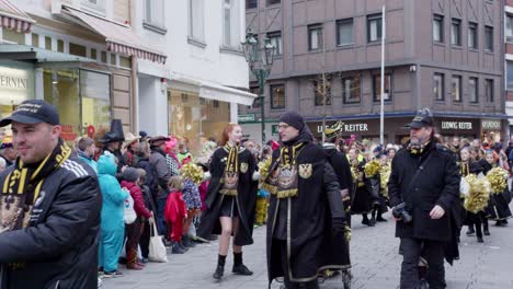Rosenmontag-Carnaval-in-Düsseldorf,-Germany-With-Black-Costum-in-Slow-Motion