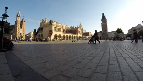 Daily-tourist-crowd-at-Sukiennice-Cloth-Hall-Krakow-old-town,-time-lapse-shot