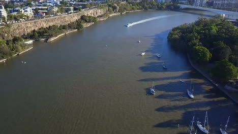 Aerial-shot-of-City-Cat-and-jet-ski-on-Brisbane-River,-Queensland