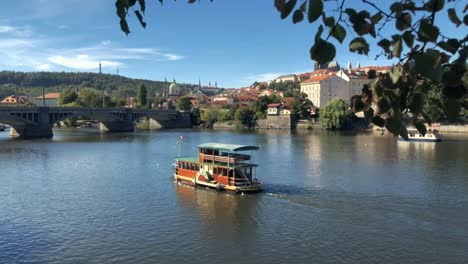 River-boat-cruises-along-Vltava-in-Prague-on-spring-day