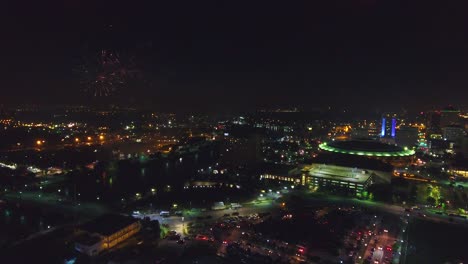 Aerial-Drone-shot-of-a-fireworks-show-over-Wichita,-Kansas
