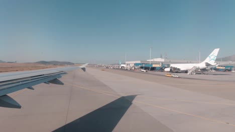View-of-the-wing-of-a-plane-from-inside-in-the-eleutherios-venizelos-airport-in-Athens