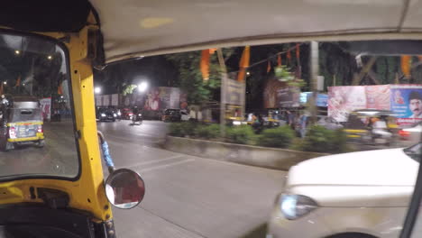 Passenger-view-from-rickshaw-driving-through-the-nightlife-in-Mumbai