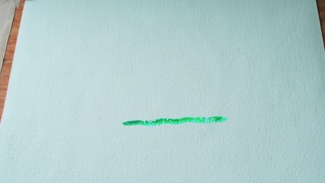 Malen-Einer-Grünen-Linie-Mit-Wasserfarben-Auf-Papier