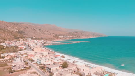 Drone-flying-over-small-Greek-town