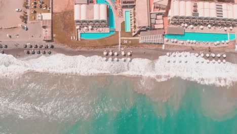 Drone-flying-over-hotel-and-beach
