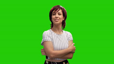 Cheerful-short-haired-brunette-woman-crossing-hands-and-posing-in-green-screen