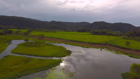 Aerial-view-from-drone-of-the-El-Porvenir-lagoon-in-cloudy-afternoon,-rural-area-of-Córdoba,-Veracruz,-Mexico