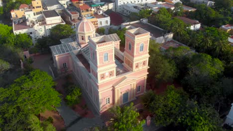 Top-Angle-Close-Up-Aerial-Orbital-shot-from-Right-to-Left-of-Our-Lady-Angeles-Church-on-an-early-morning-near-the-french-town,-Puducherry-shot-with-a-drone-in-4k