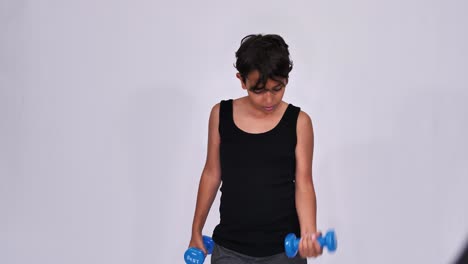 Teenager-boy-lifting-exercise-dumbbells-isolated-on-white-background