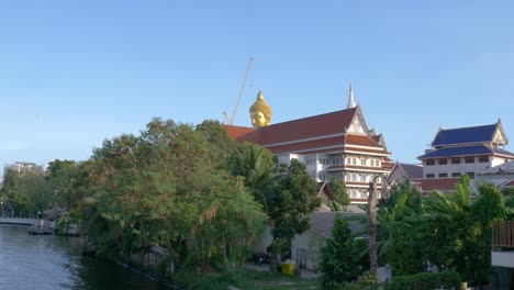 A-large-buddha-head-towering-over-a-neighborhood-in-Thailand