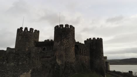 Historical-medieval-Conwy-castle-landmark-aerial-view-slow-zoom-in