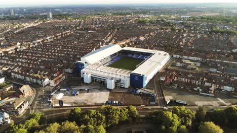 Iconic-Goodison-Everton-EFC-football-club-stadium-aerial-high-orbit-right-view-at-sunrise