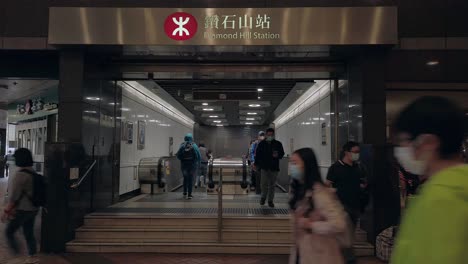 Corona-Virus-Pandemic,-Local-Commuters-at-Hong-Kong-Diamond-Hill-underground-MTR-station,-wearing-protective-face-masks