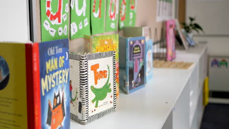 CLOSE-UP-Of-Children’s-School-Books-On-Display-In-A-Classroom