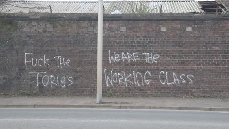 Close-up-of-anti--government-graffiti-on-a-brick-wall