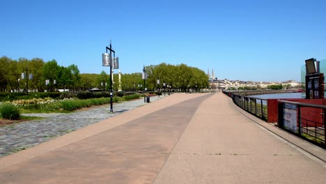 Garonne-river-shore-Quai-or-dock-deserted-during-the-COVID-19-pandemic,-Dolly-right-shot