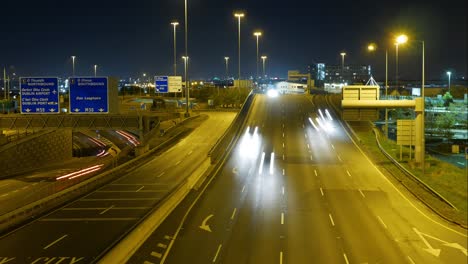 Vehicles-Travelling-At-The-N7-Motorway-Town-Exit-In-Dublin,-Ireland-At-Night---timelapse