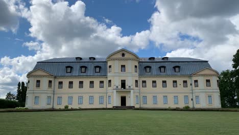Kraslava-manor-during-sunny-day-with-moving-clouds---Time-lapse-zoom-out