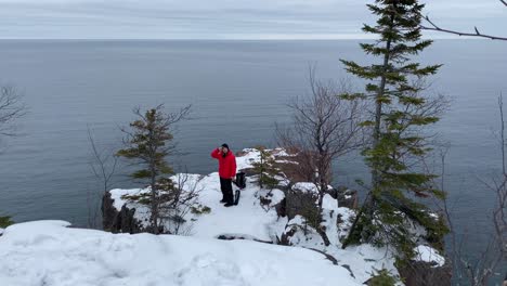 person-looking-to-lake-superior-standing-on-a-cliff-in-palisade-head,-minnesota-state-parks-travel