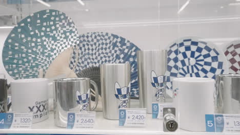 Themed-Souvenirs-Of-The-Cancelled-Olympic-2020-Display-On-Rack-Inside-The-Official-Tokyo-Olympic-Store-In-Tokyo,-Japan