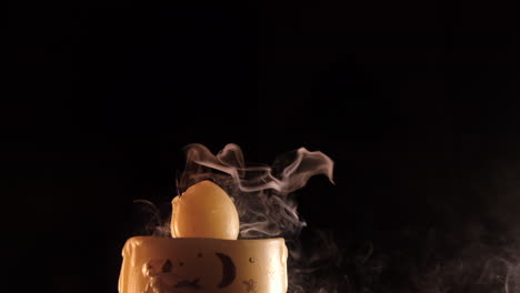 Blowing-on-Christmas-candle-at-slow-motion