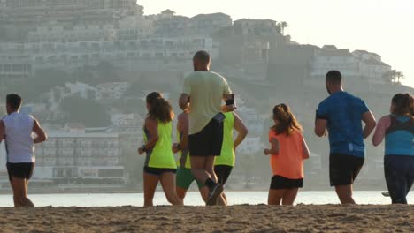 Runners-in-a-race-in-the-morning-at-the-beach-of-Cullera