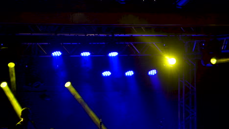 Stage-lighting-with-yellow-and-blue-lights-at-live-concert