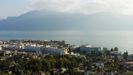 Aerial-shot-above-Vevey,-Lake-Léman-and-the-Alps-in-the-background-Vaud---Switzerland