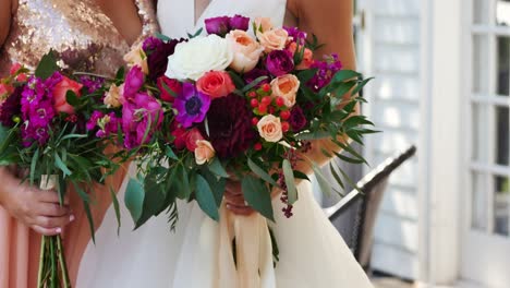 Bride-and-bridesmaid-holding-bouquets