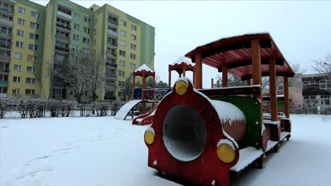 Snow-is-falling-in-a-small-playground-in-the-city