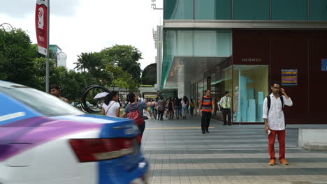 Singapore---Circa-Tilting-up-time-lapse-shot-of-the-crowded-orchard-road-in-Singapore
