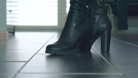 Woman-presents-her-sexy-high-heels-in-the-catwalk-silently-in-the-apartment-filmed-from-the-floor-closeup