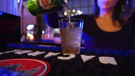 Female-Bartender-making-drink-soda