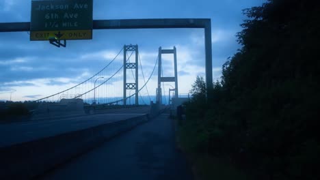 Hyper-lapse-of-the-Tacoma-Narrows-Bridge,-Sunrise,-light-traffic
