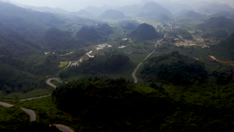 Aerial-dolly-left-shot-of-the-misty-mountains-of-northern-Vietnam