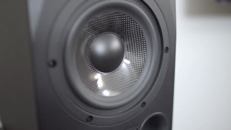 Subwoofer-booming-as-camera-dollies-by-a-studio-speaker